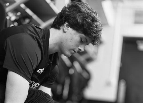 U18 Forward Liam Christopher ‘26  laces up his skates. 